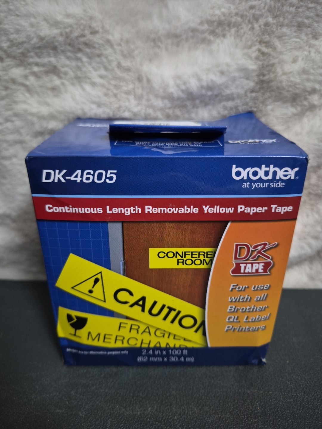 Brother DK4605 2.4 in x 100 ft. (62 mm x 30.4 m) Black on Yellow Removable