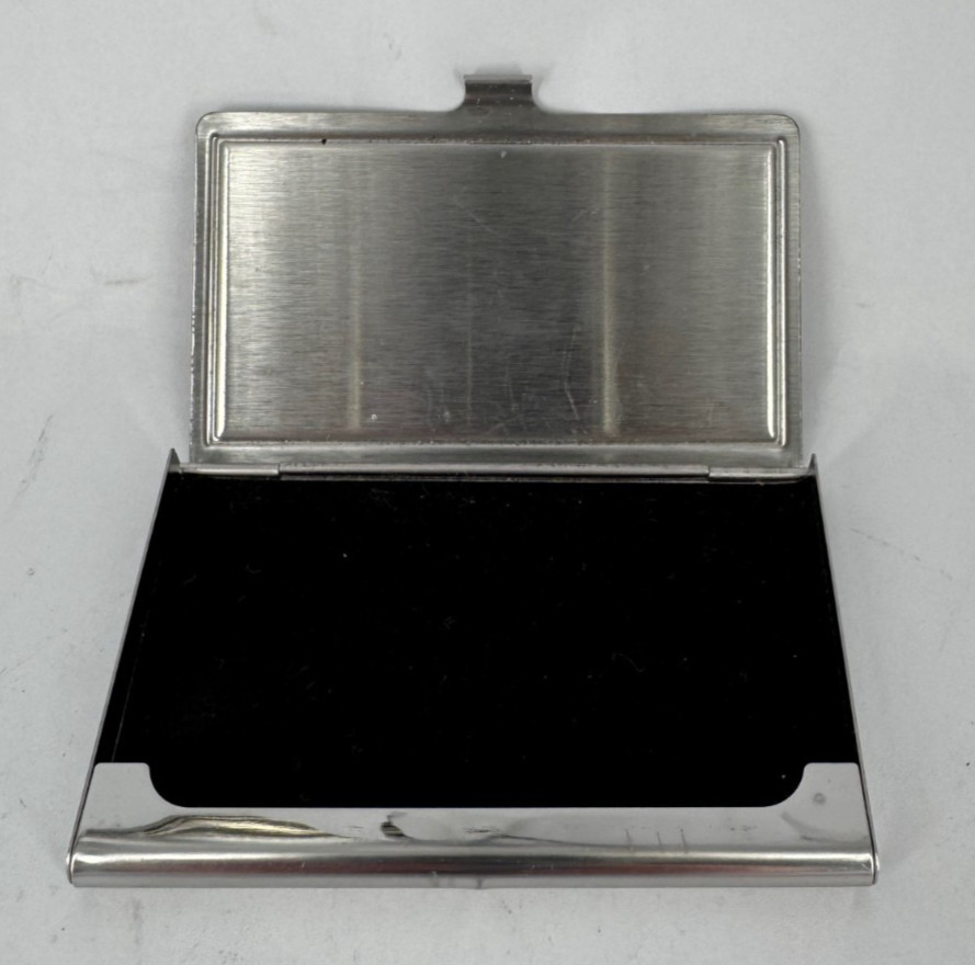 silver metal business card holder with a black interior 3-3/4″ x 2-1/4″ (AK)