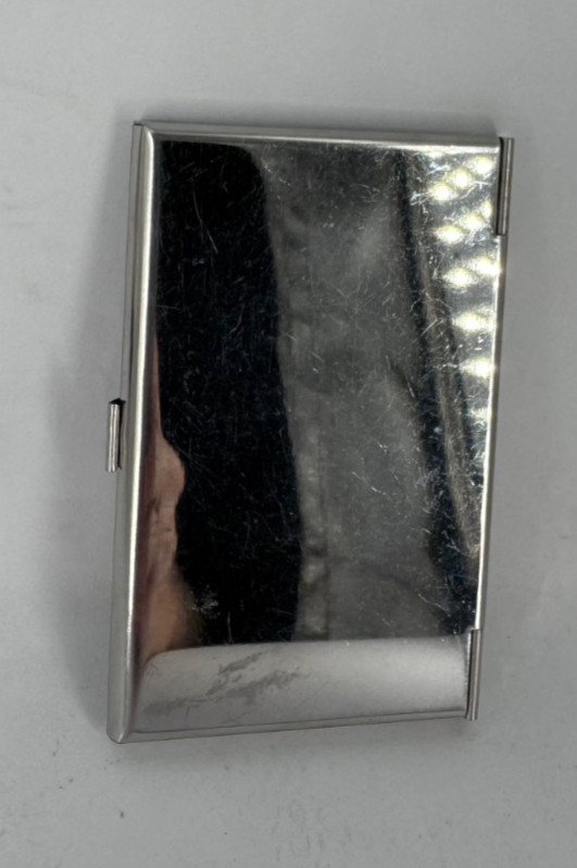 silver metal business card holder with a black interior 3-3/4″ x 2-1/4″ (AK)