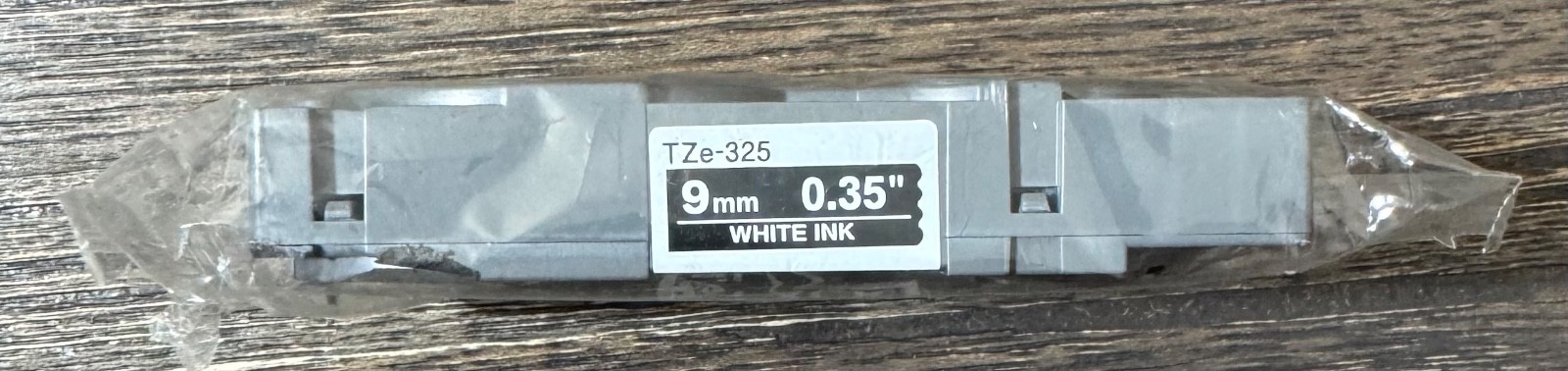 P-Touch Brother TZe-325 Label Tape 3/8″ | White Print On Black Tape
