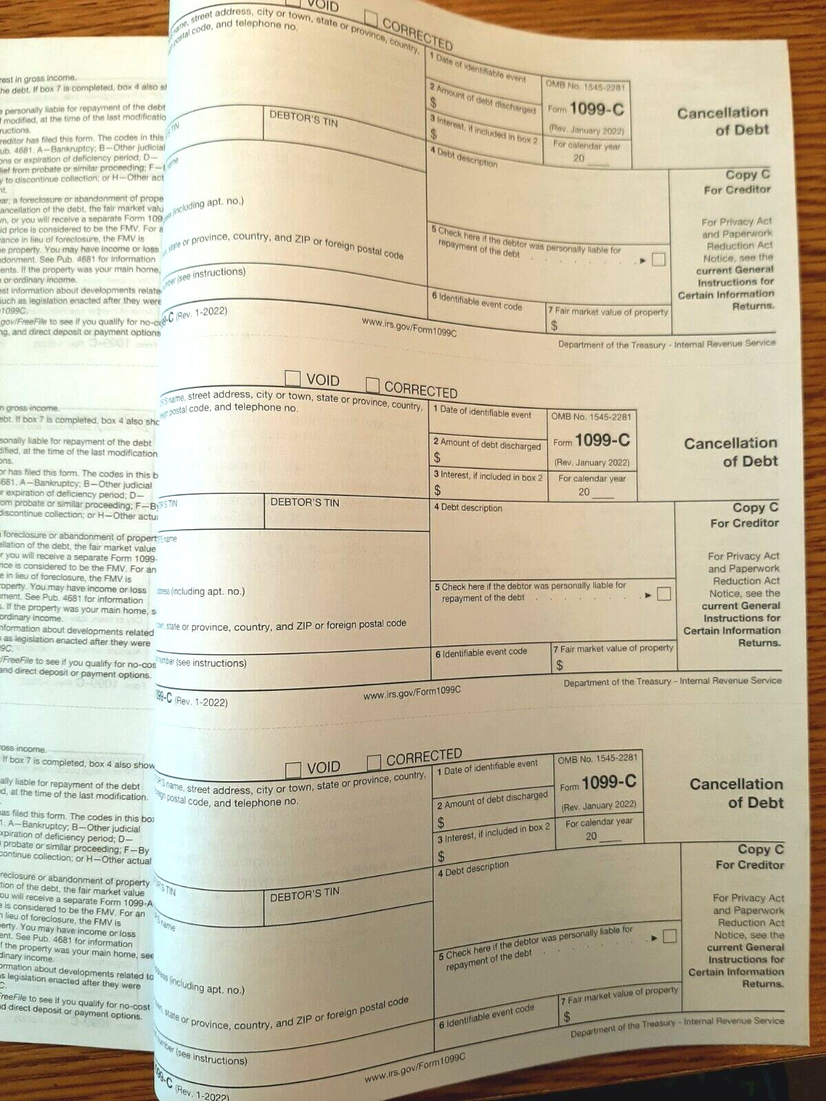 Undated IRS Tax Form 1099-C single sheet set for 3 debtors, carbonless 3-pt, 3UP