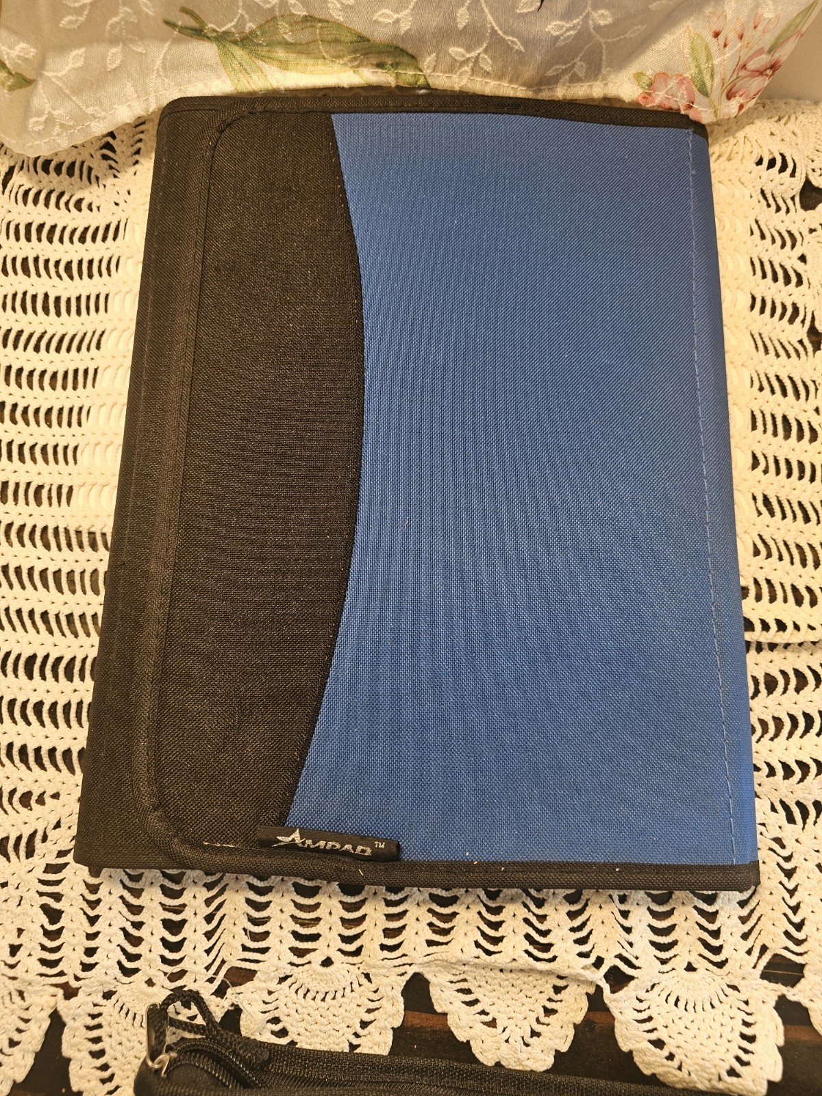 Two Blue And Black Binders By Ampads